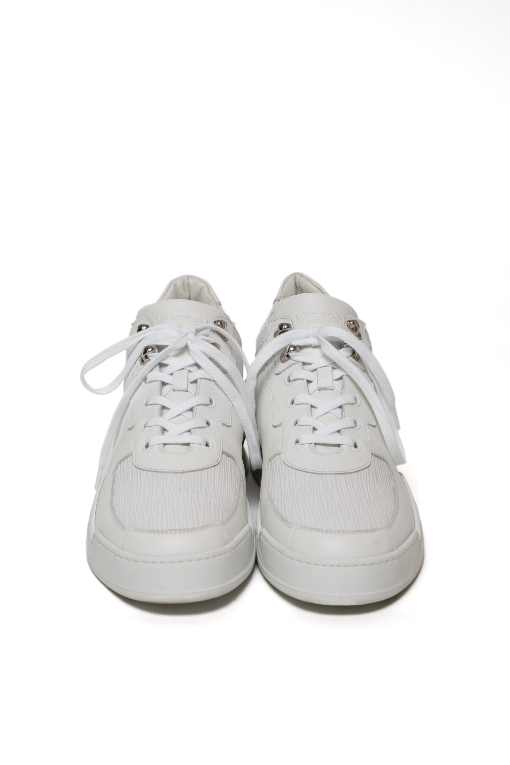 Front view of the Vaarora Aurel Mid Top luxury sneaker featuring monochromatic white leather and silver eyelets