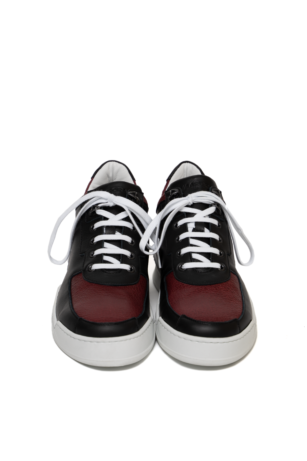 Front view of the Vaarora Aurel Mid Top luxury sneaker featuring black leather, vino red paneling, and white laces